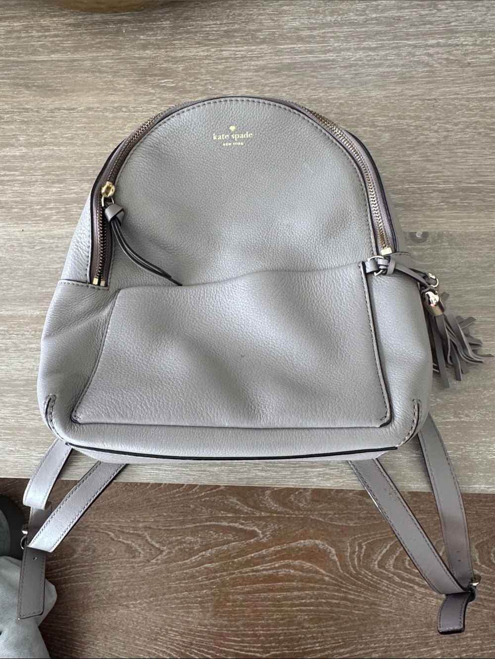 kate spade gray pebble leather mini backpack with tassel